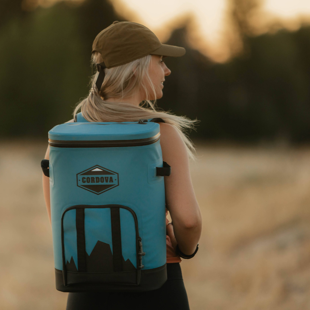Lightweight cooler backpack being comfortably worn by female hiker  [Yonder][Scree]