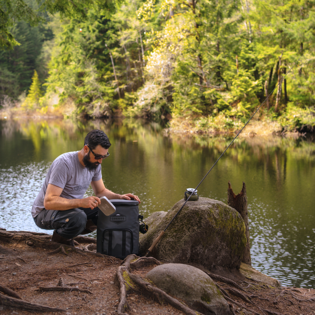 24 can gray backpack cooler being used while fishing  [Yonder][Scree]