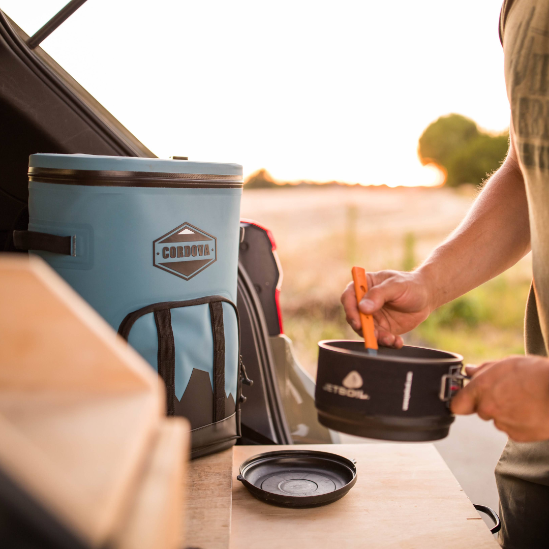 24 can blue backpack cooler being used for camping meals  [Yonder][Scree]
