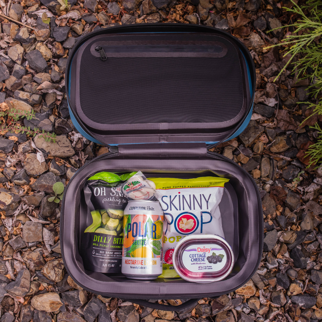 Looking inside a yonder blue cordova insulated cooler lunch bag in a nature setting {Scree]